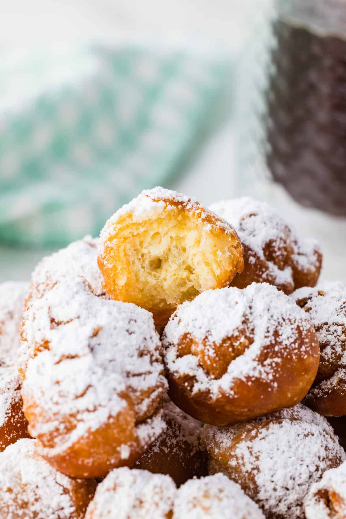 stack of biscuit donut holes with bite missing from top one
