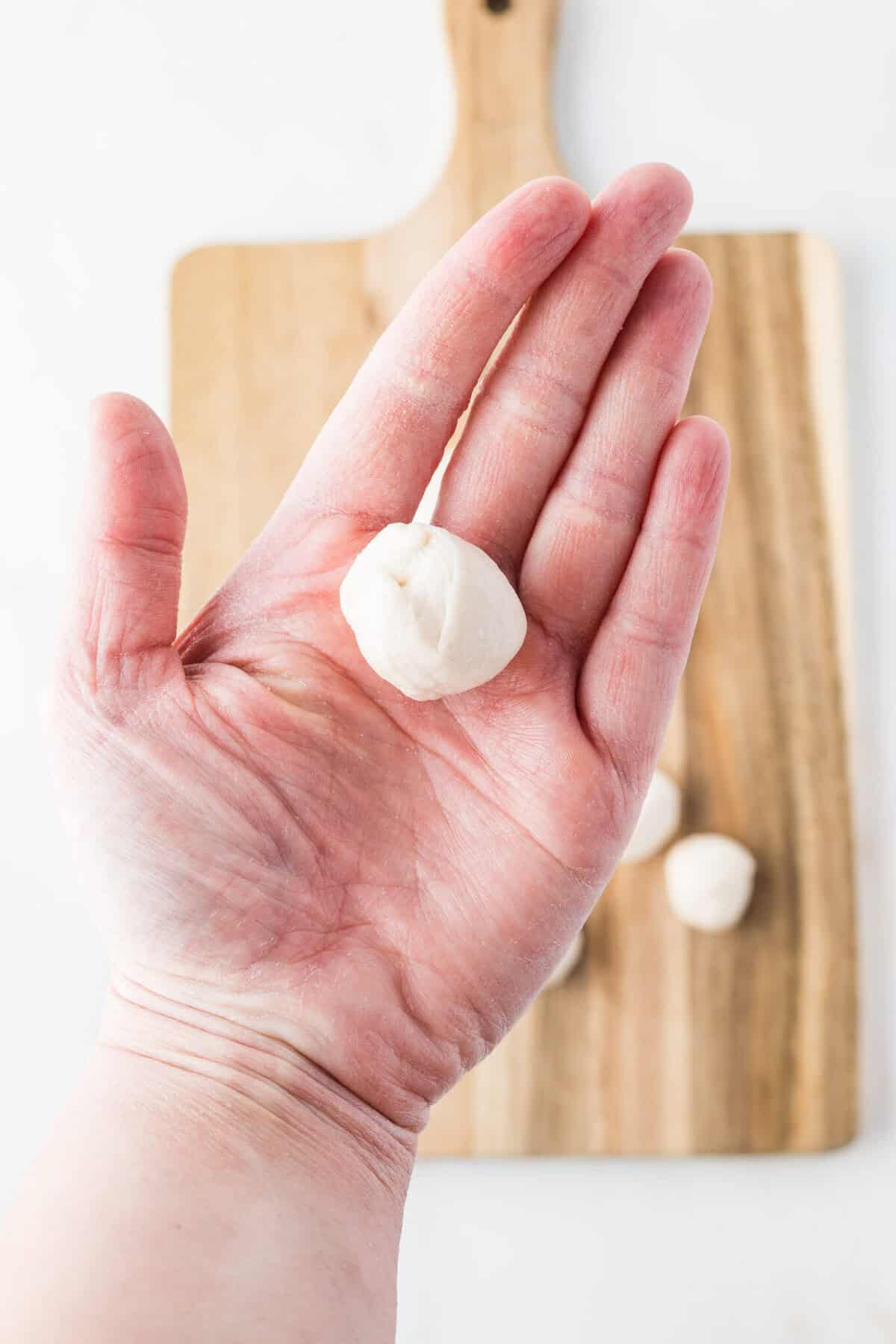 roll each piece of biscuit into a tight ball