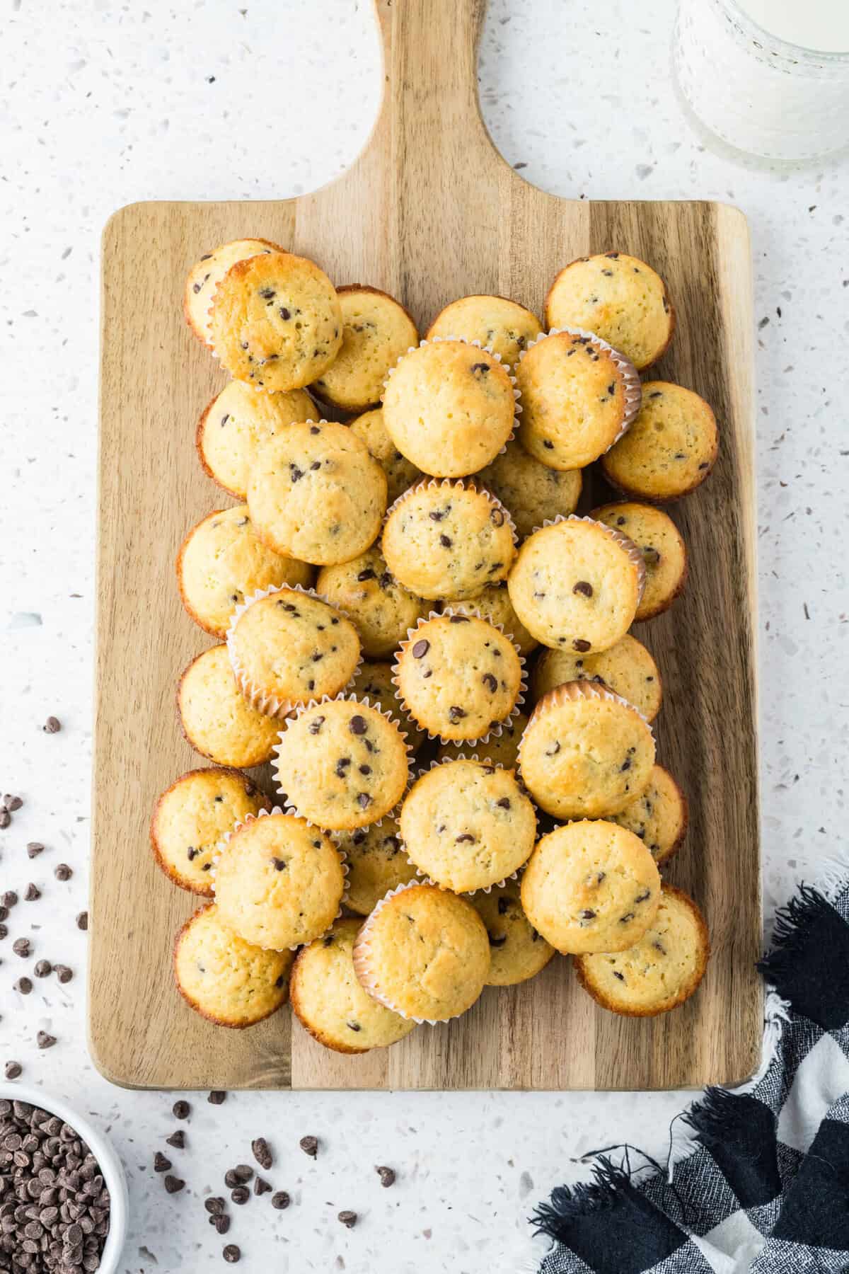 mini chocolate chip muffins on cutting board 