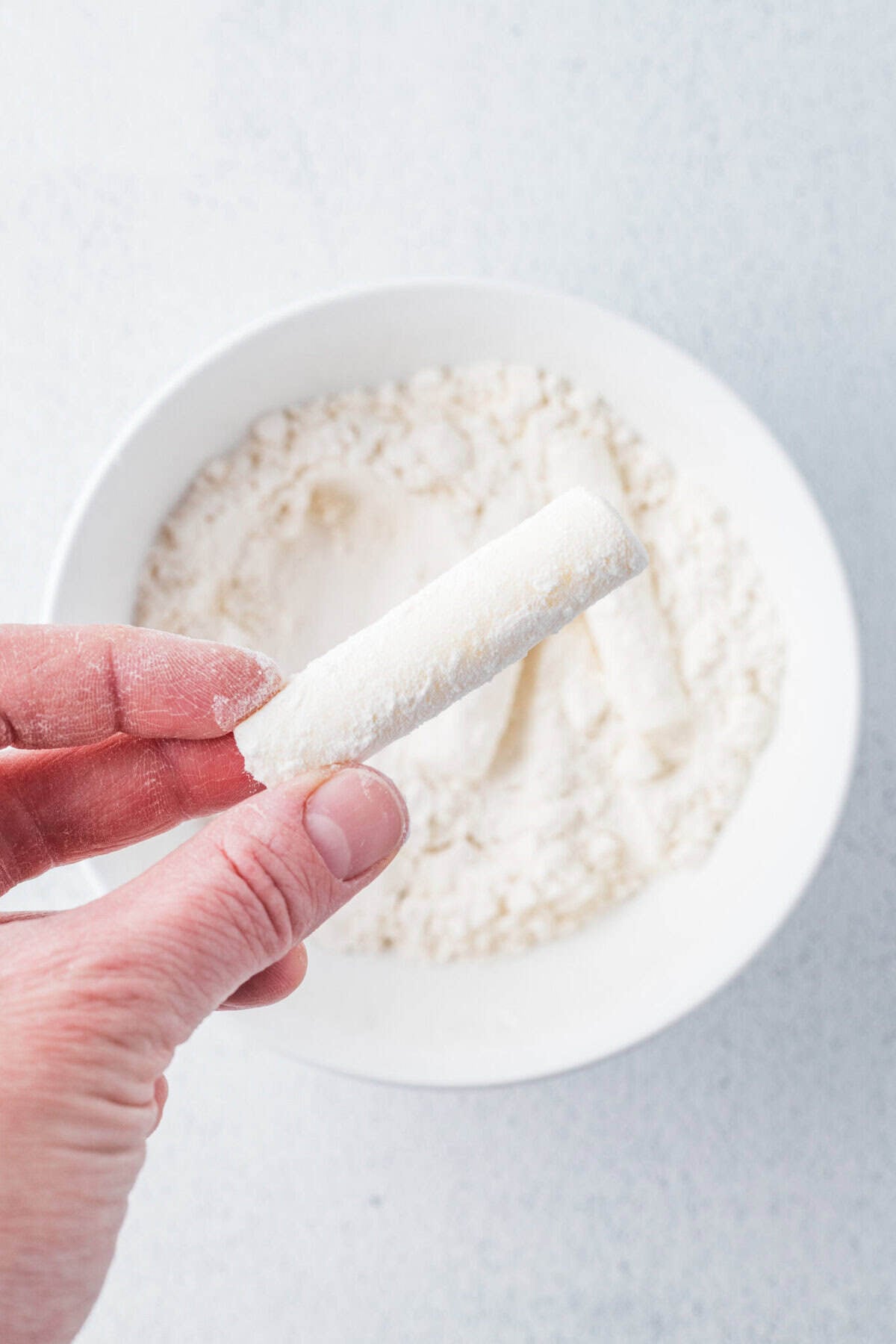 cheese stick coated in flour