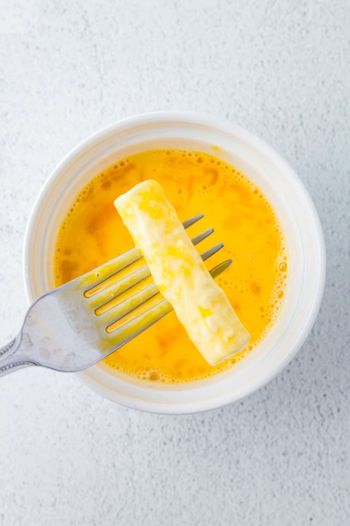 cheese sticks dipped in egg mixture