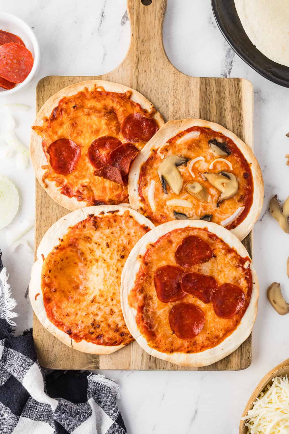 air fryer pizzas on a cutting board