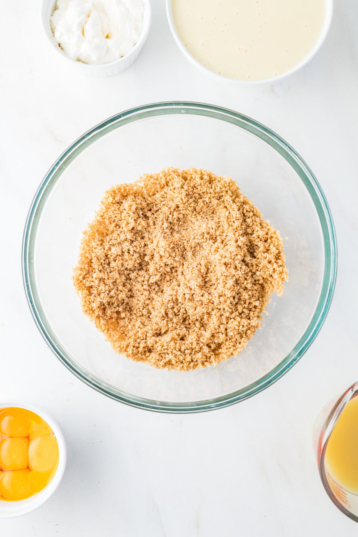 graham cracker crust ingredients mixed in a bowl