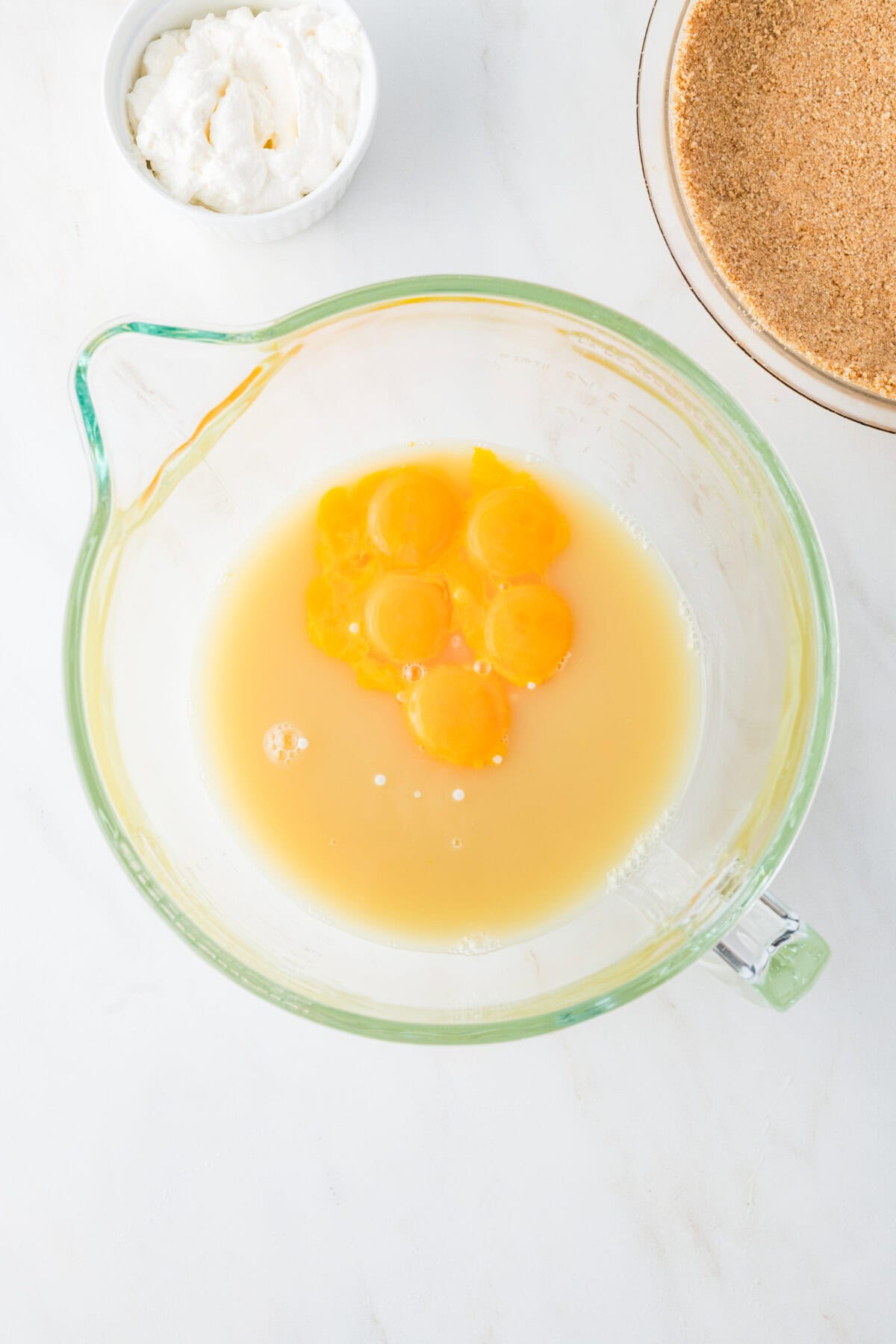 key lime pie filling ingredients in a clear bowl
