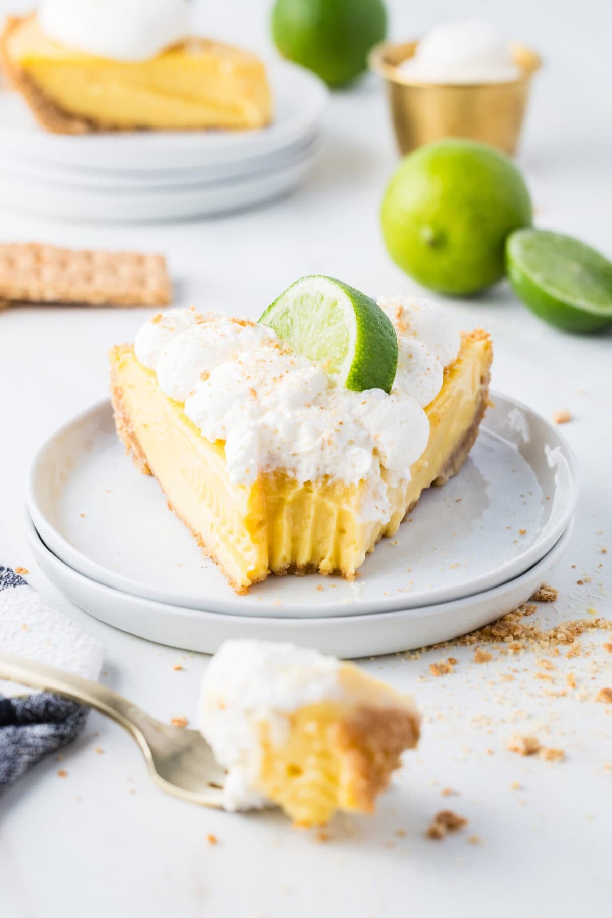 slice of key lime pie with bite missing