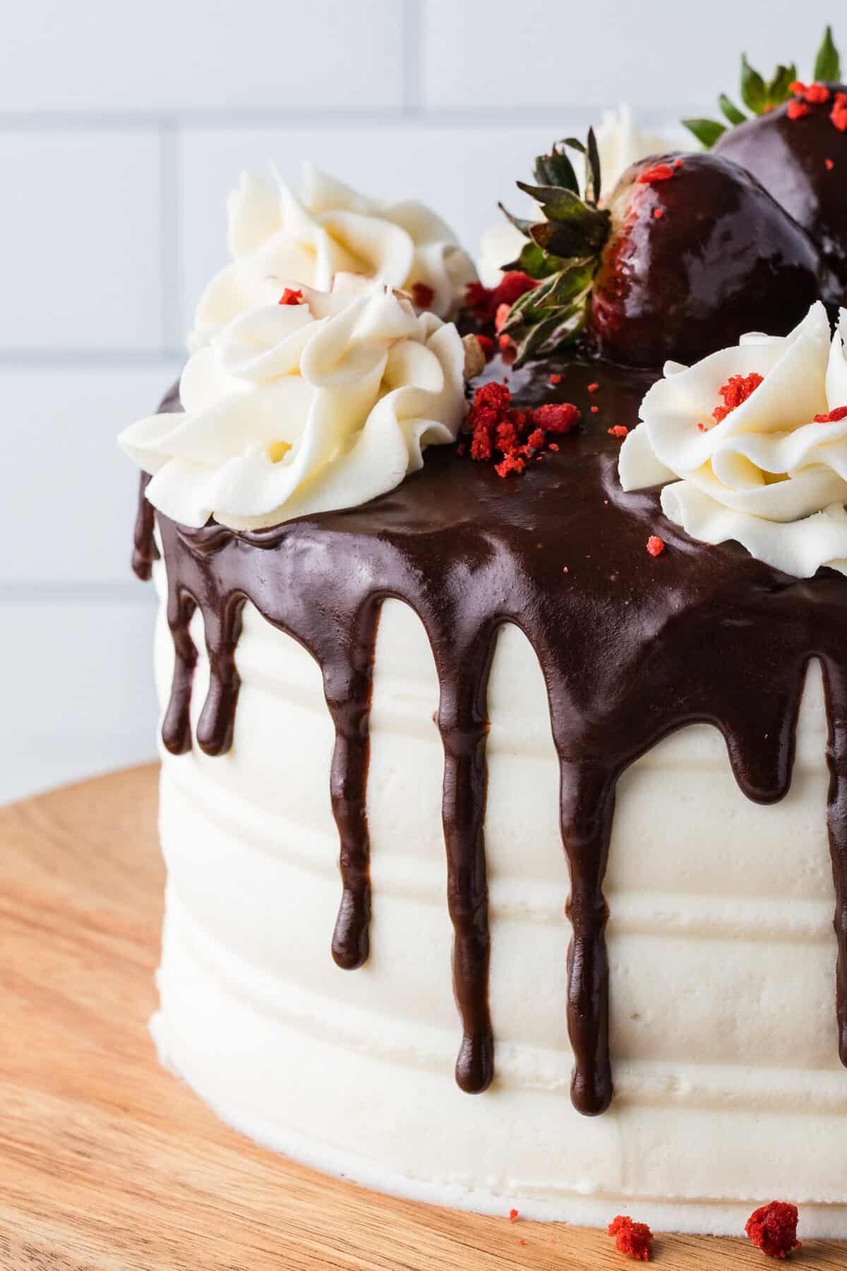 chocolate ganache dripping on a red velvet cake