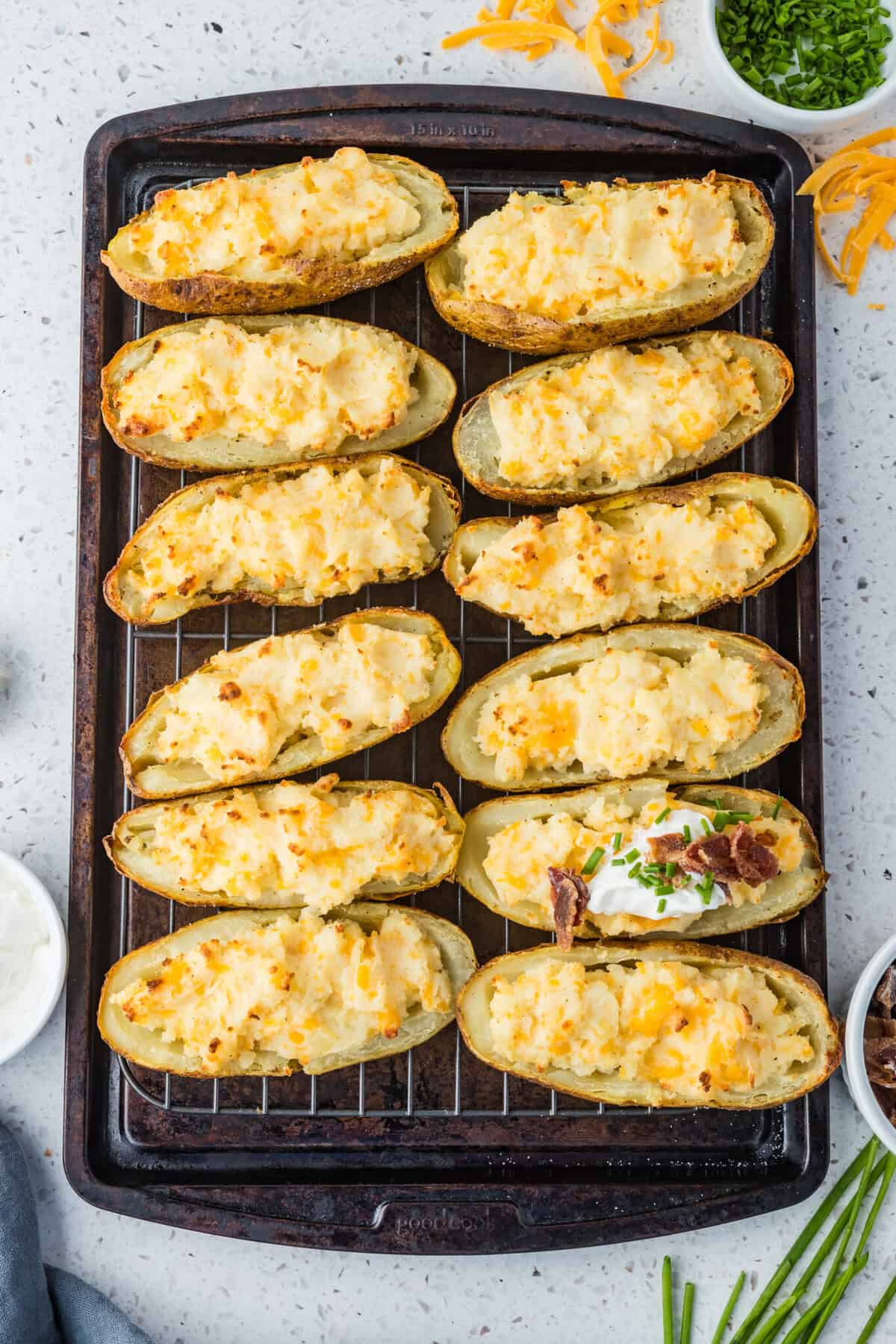 twice baked potatoes on cookie sheet