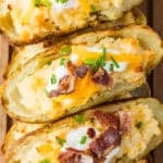 twice baked potato with sour cream, cheese and bacon pieces