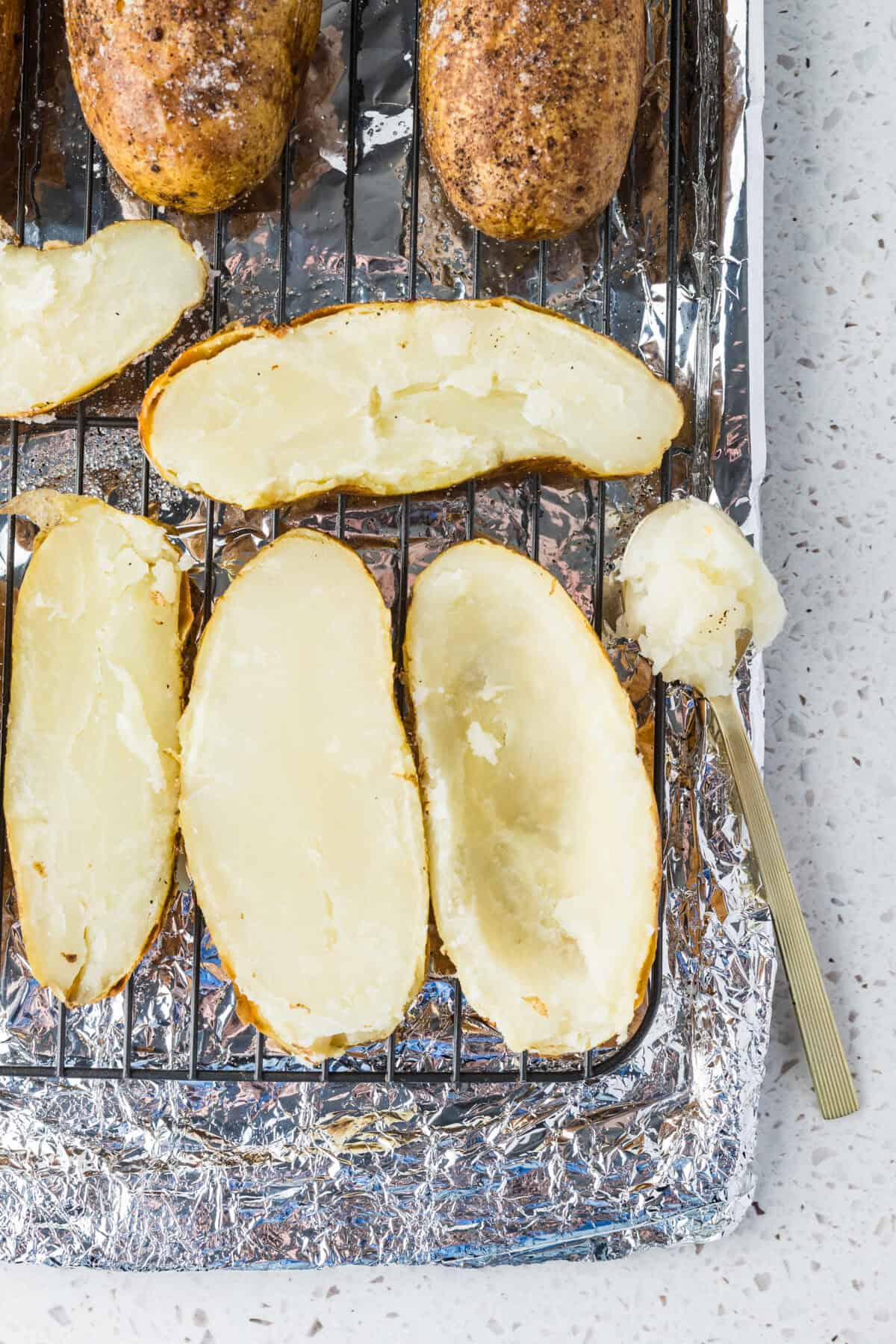 baked potatoes with filling scooped out
