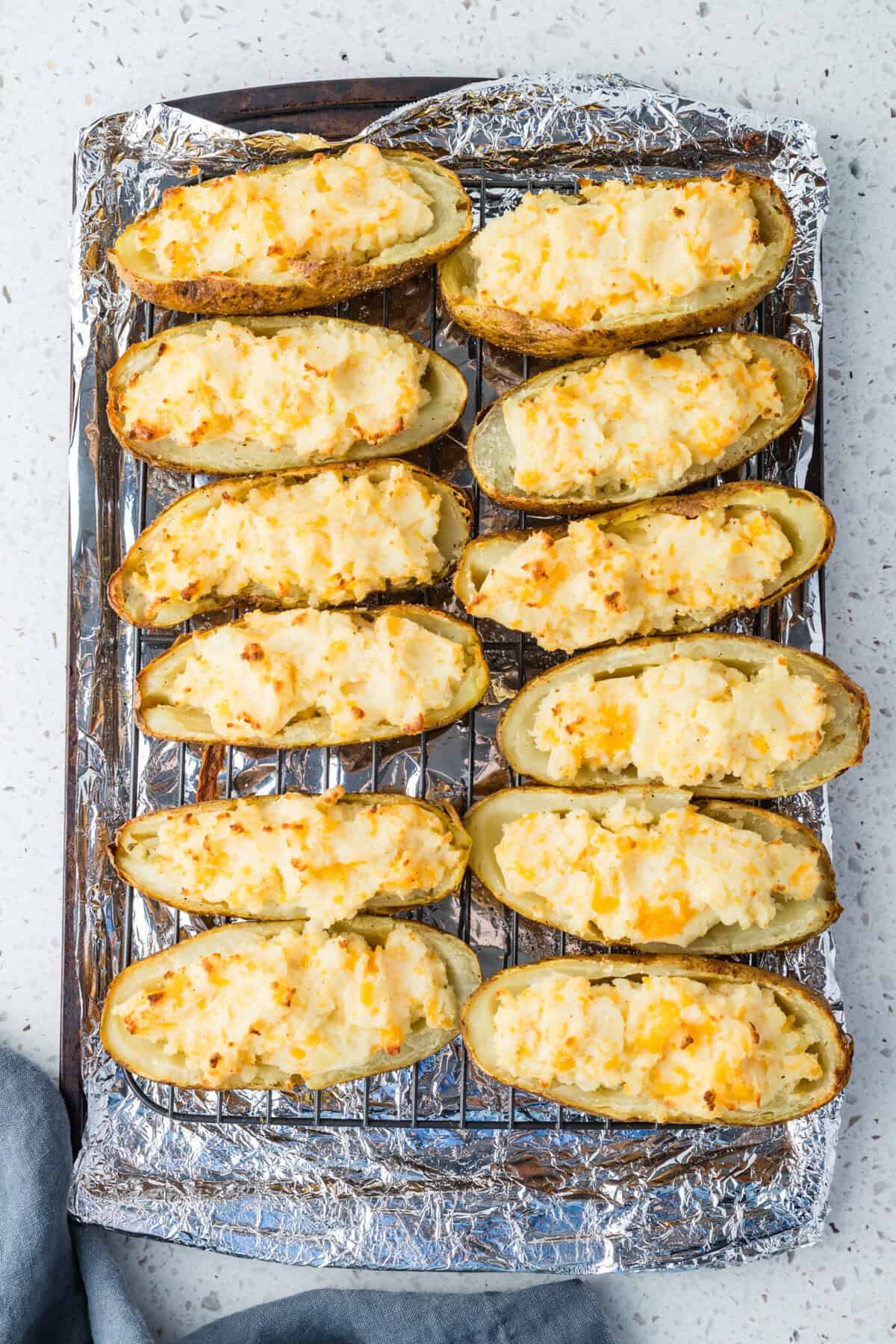 twice baked potatoes on cookie sheet
