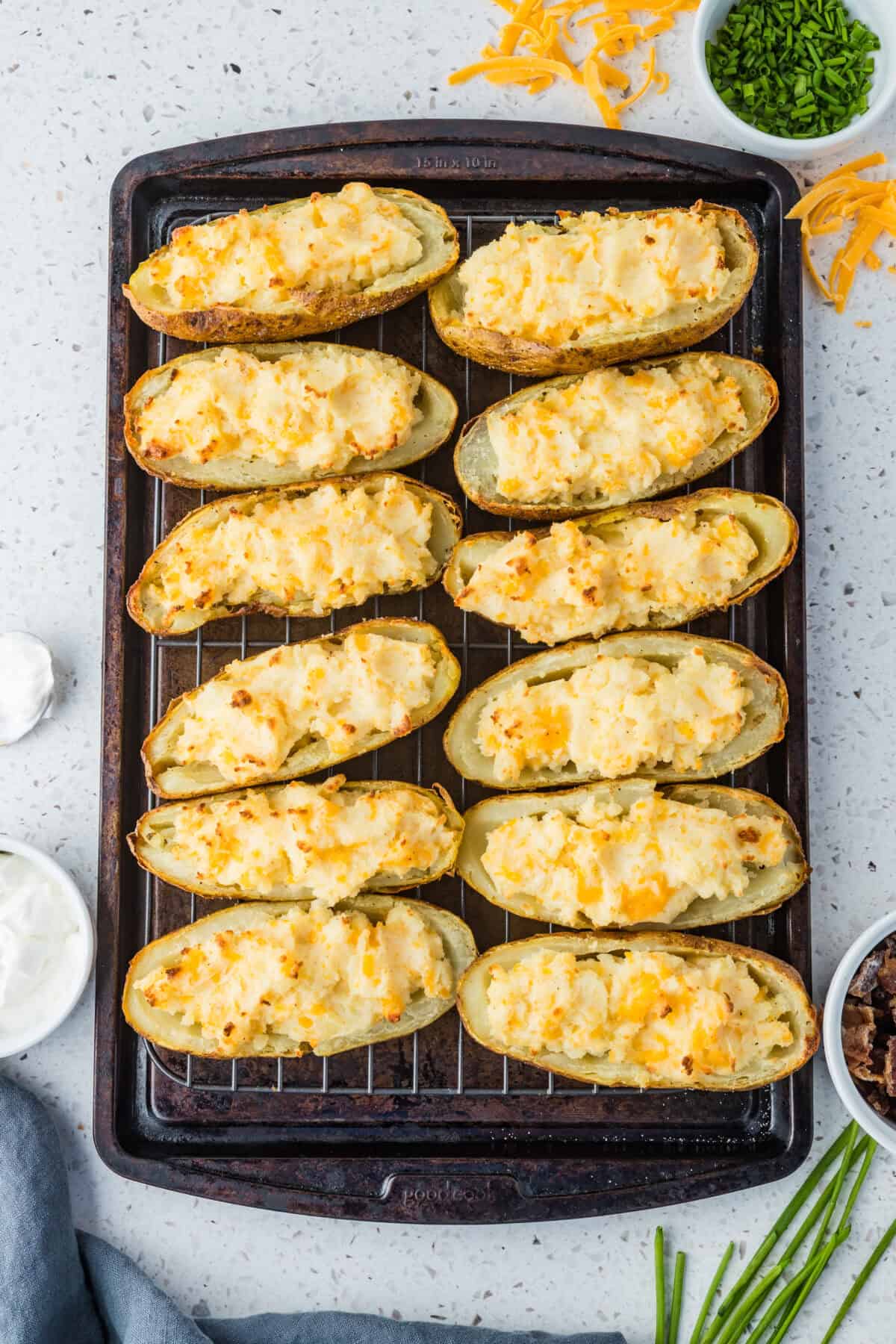 twice baked potatoes on cookie sheet