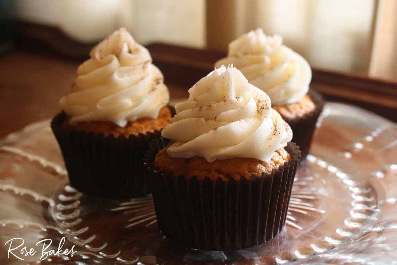 pumpkin spice cupcakes on clear serving plate 