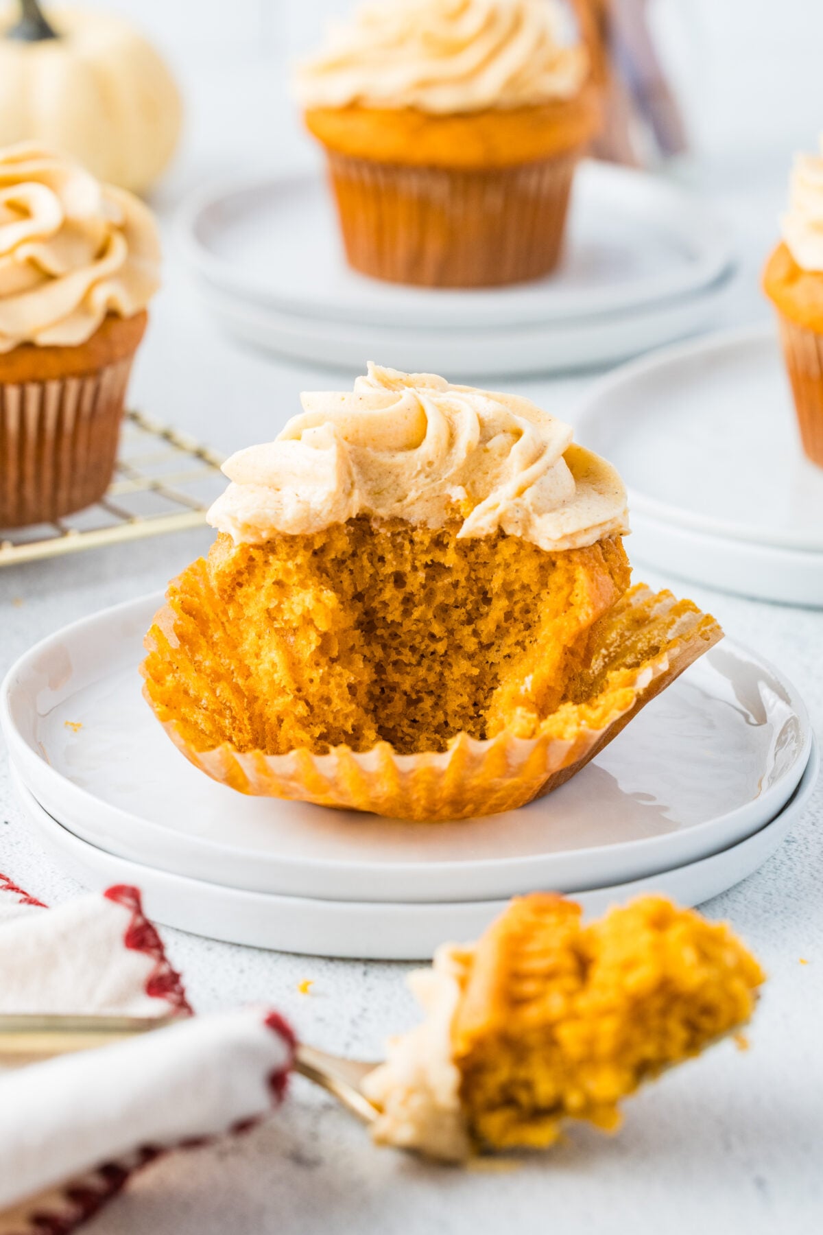 pumpkin spice cupcake with a bite missing