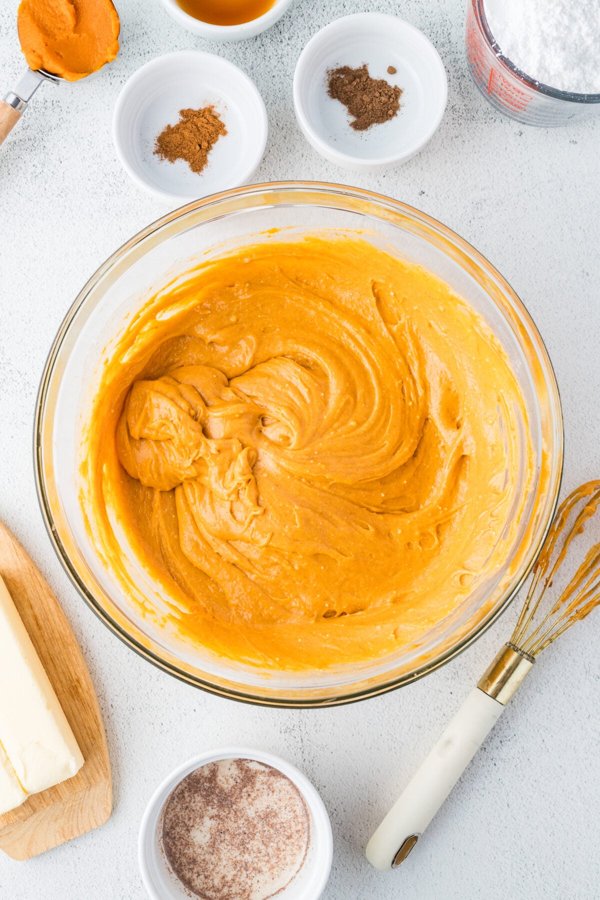 pumpkin spice cupcake batter in a mixing bowl