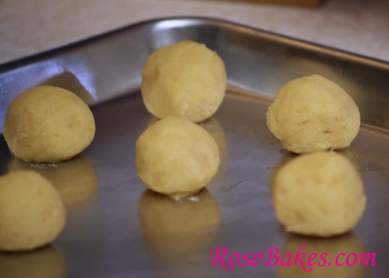 1 inch dough balls lined on a cookie sheet