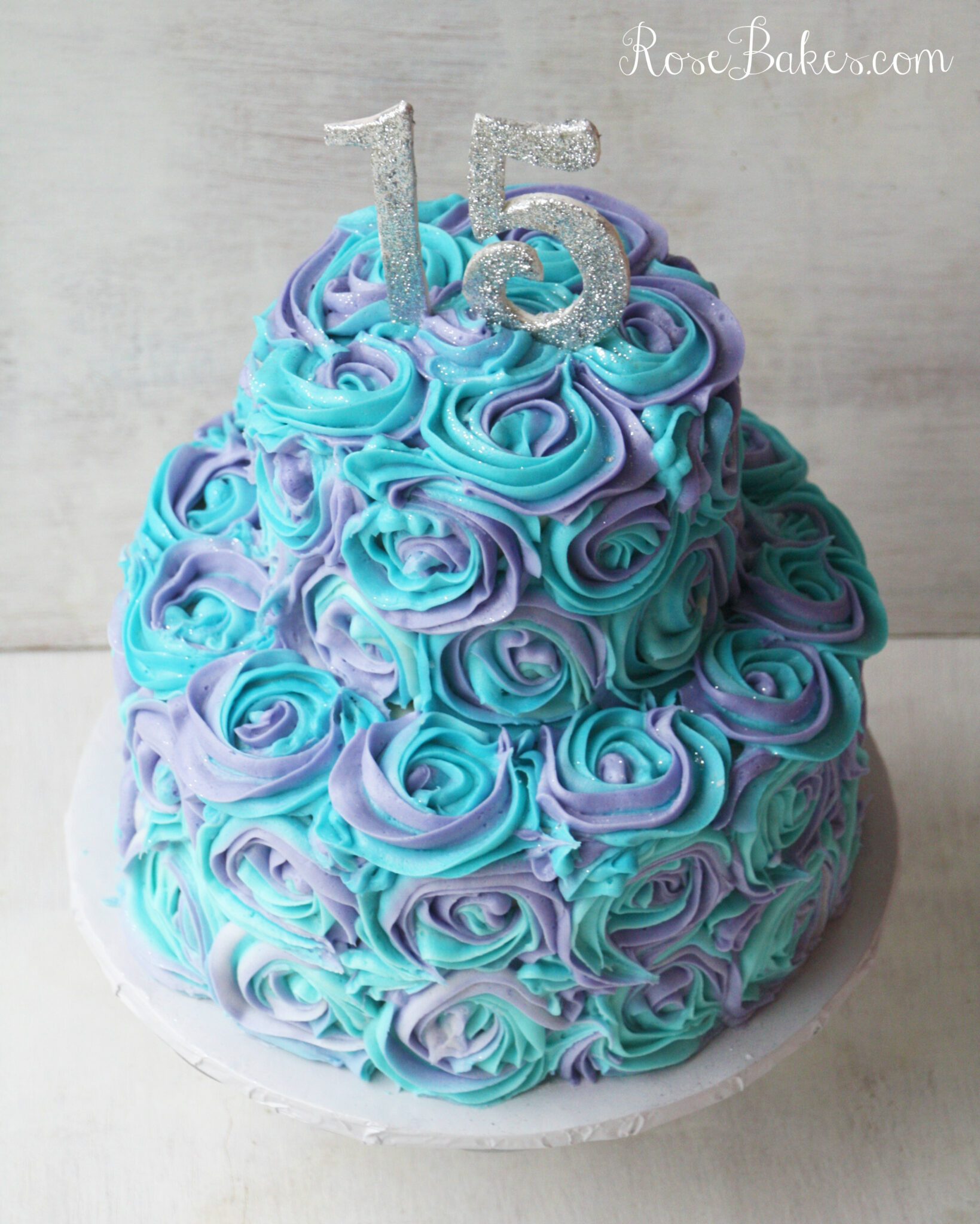 teal and purple buttercream roses cake