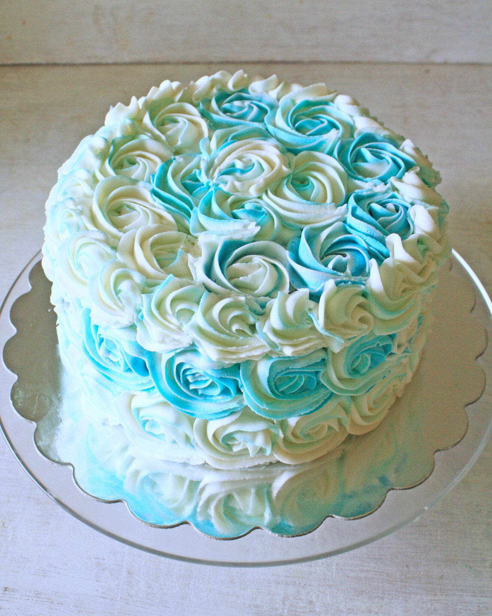blue and white buttercream roses cake