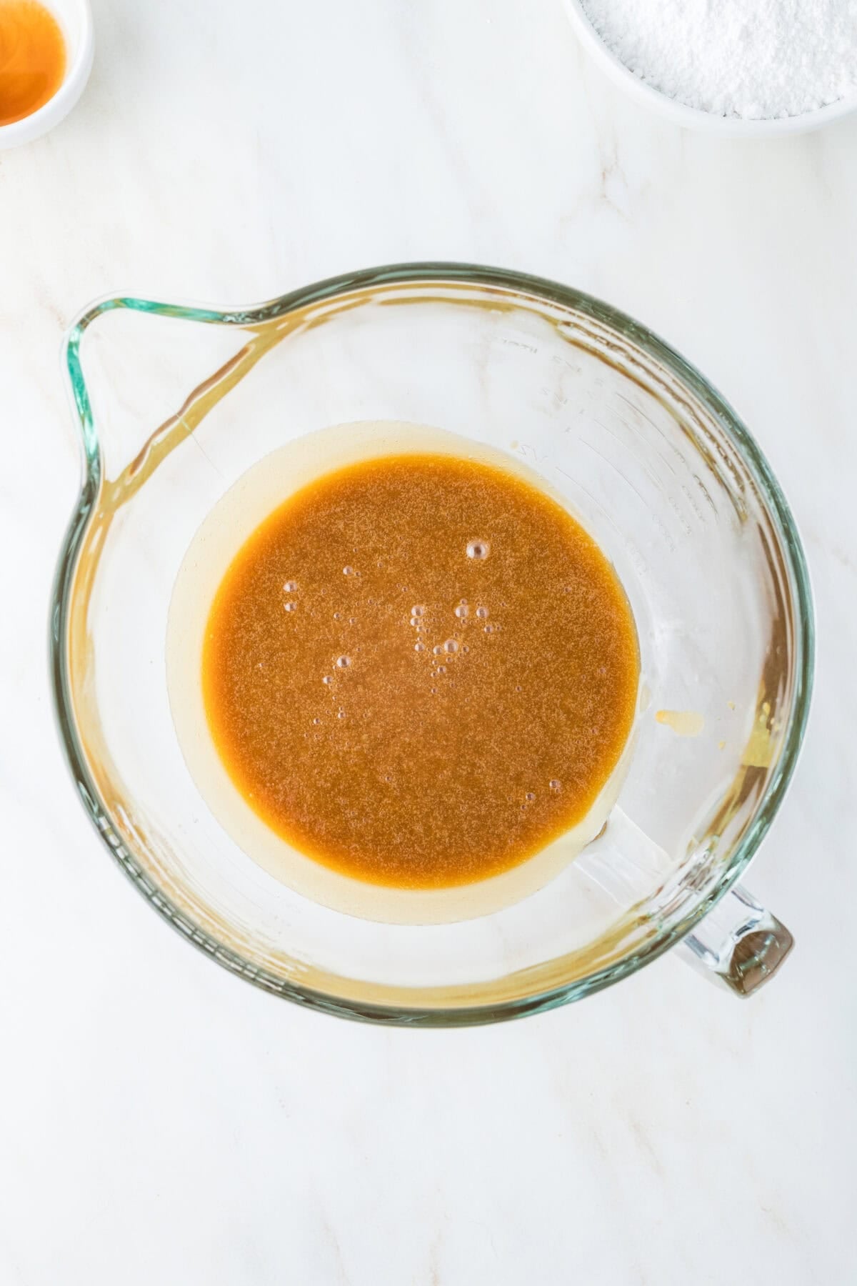 caramel icing ingredients in a mixing bowl