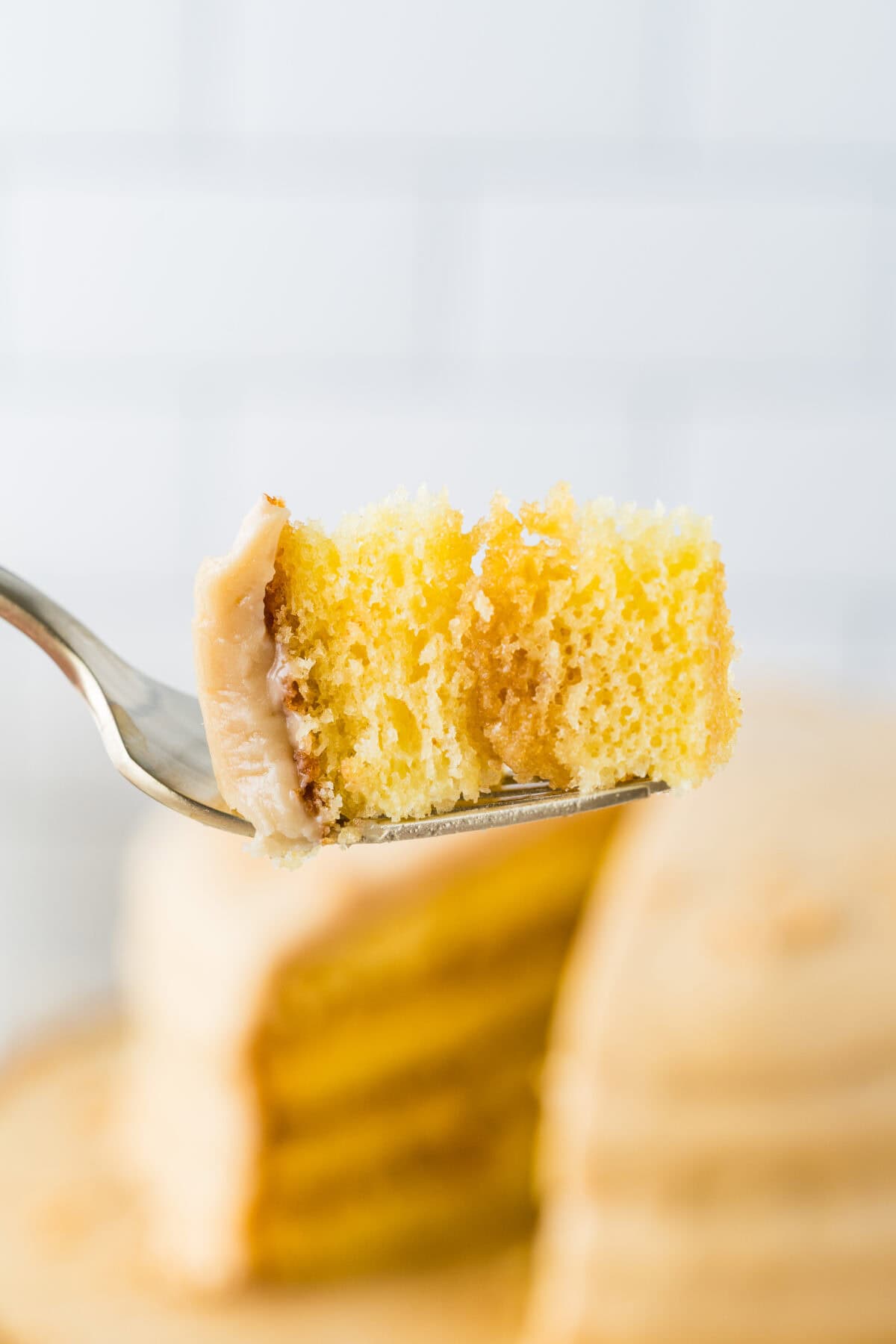 bite of caramel cake on a fork