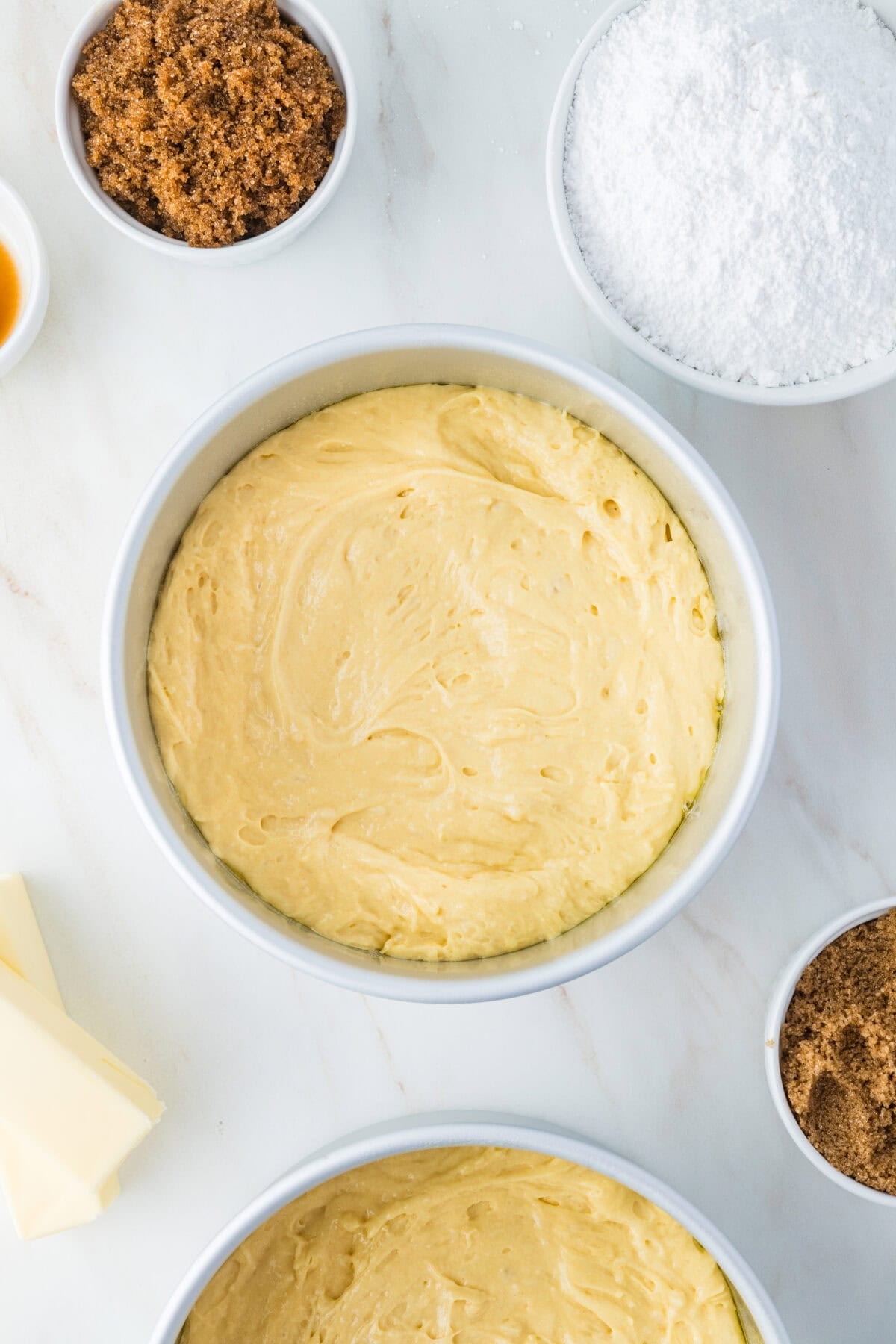 vanilla cake batter in cake pans