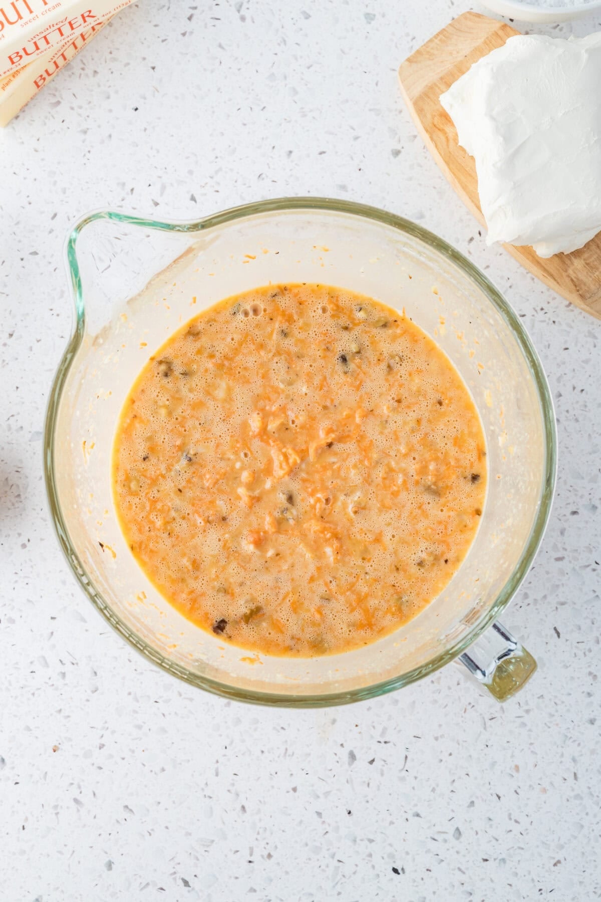 carrots, fruits and nuts mixed into carrot cake batter
