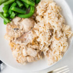 pork chops and rice on a plate with green beans