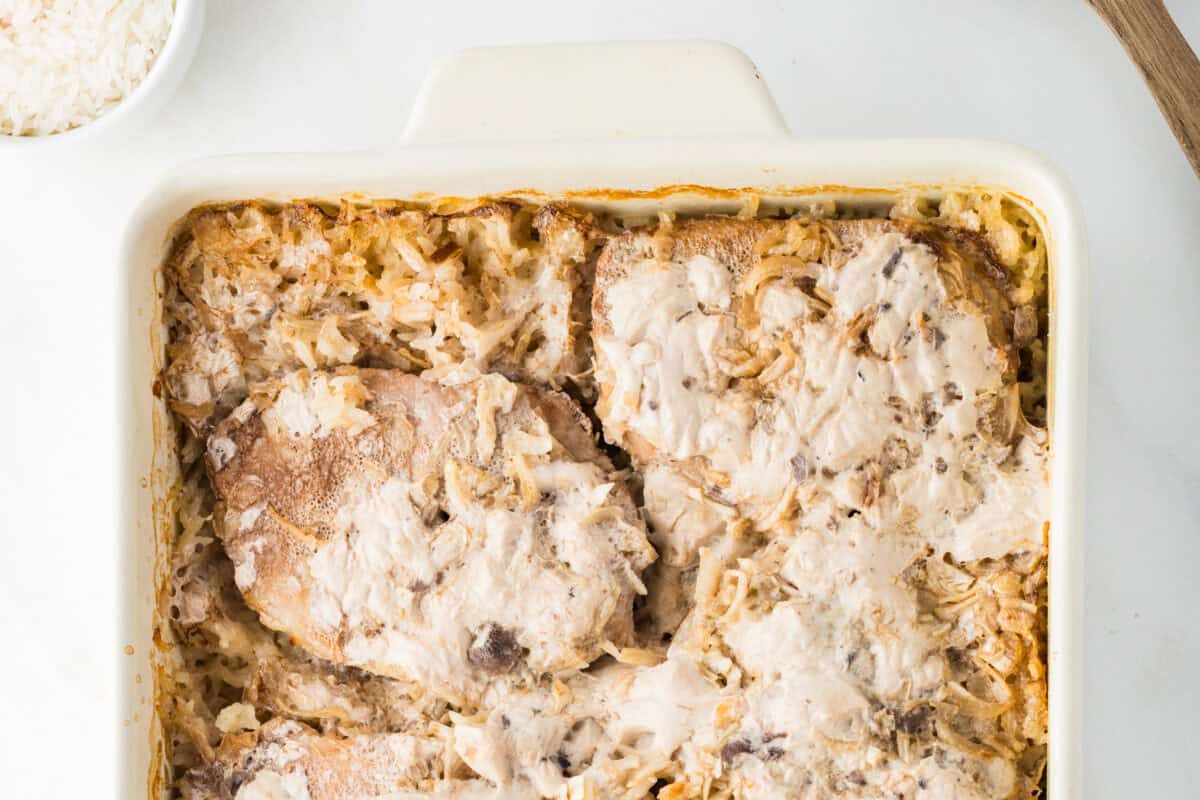 simple pork chops and rice in a baking dish