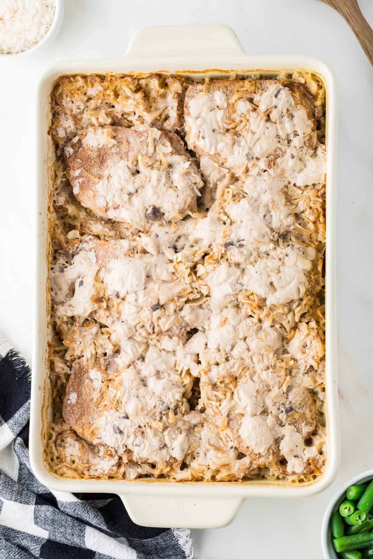 pork chops and rice in a baking dish
