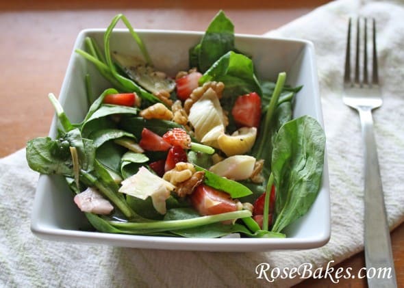 Strawberry Spinach Summer Salad chicken salad on white serving plate