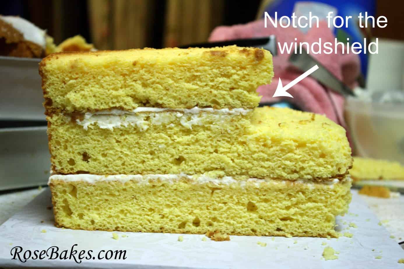 a side look of the layered cake with text pointing to "notch for the windshield"