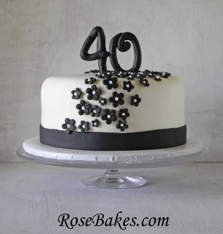Black White 40th Birthday Cake Flowers Front Front view of black and white cake with black flowers and black 40 topper