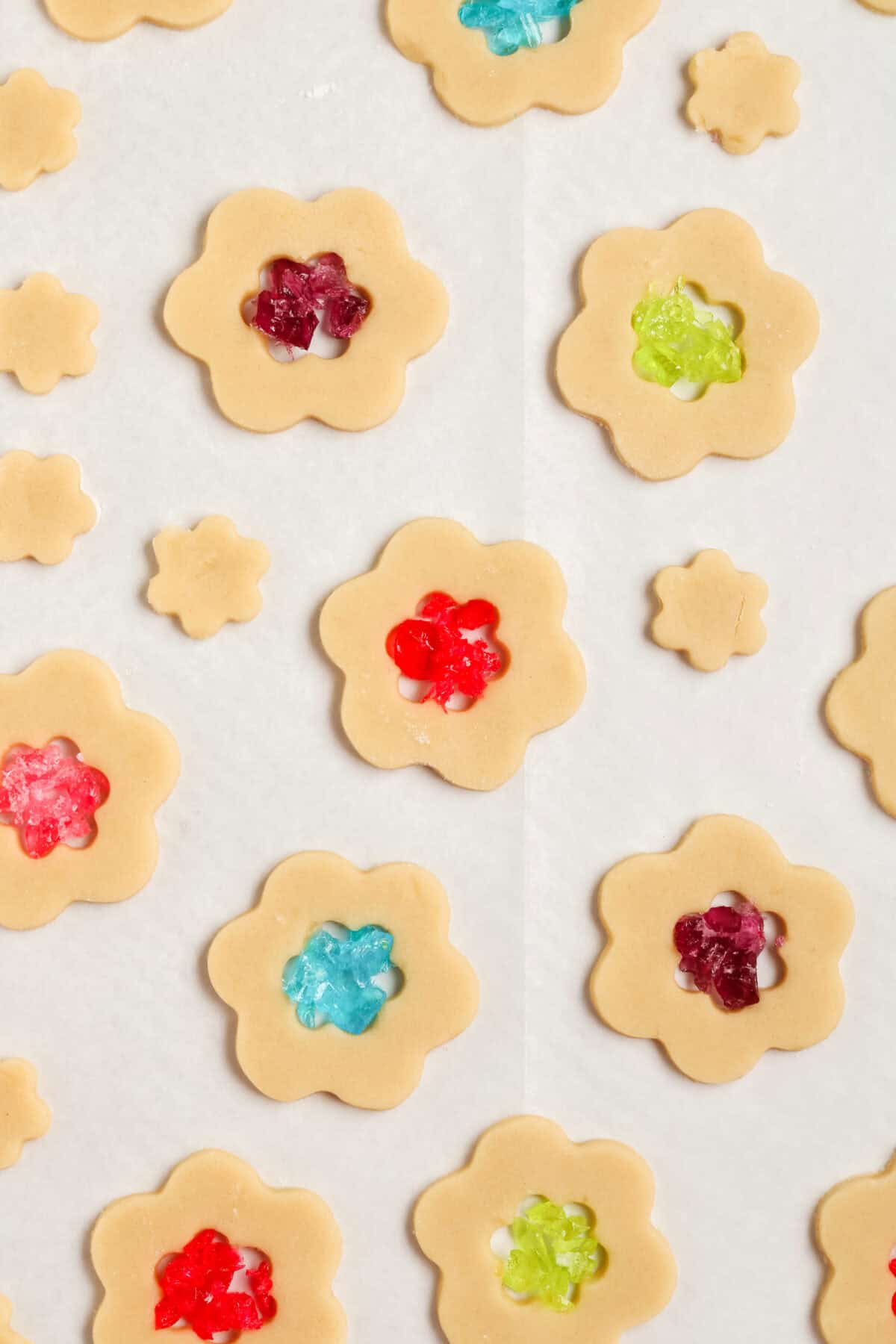 raw cookies with crushed jolly ranchers in the center