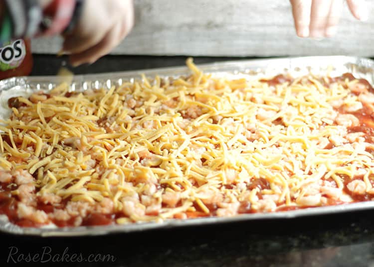 Sprinkle Cheese over the Shrimp Dip