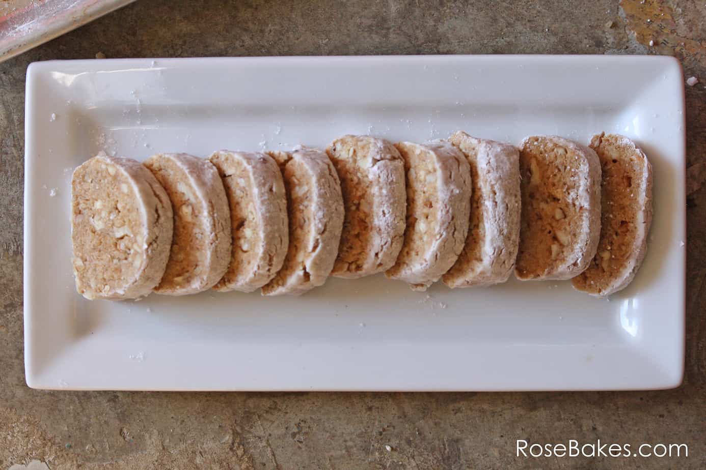 overhead shot of a platter of sliced graham cracker nut roll