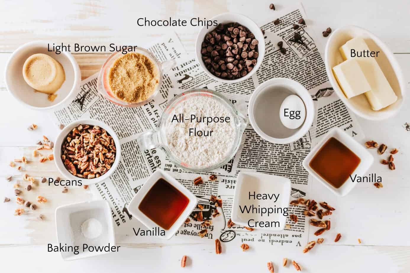 Chocolate Pecan Pie Cookie Ingredients sitting on a surface with newsprint