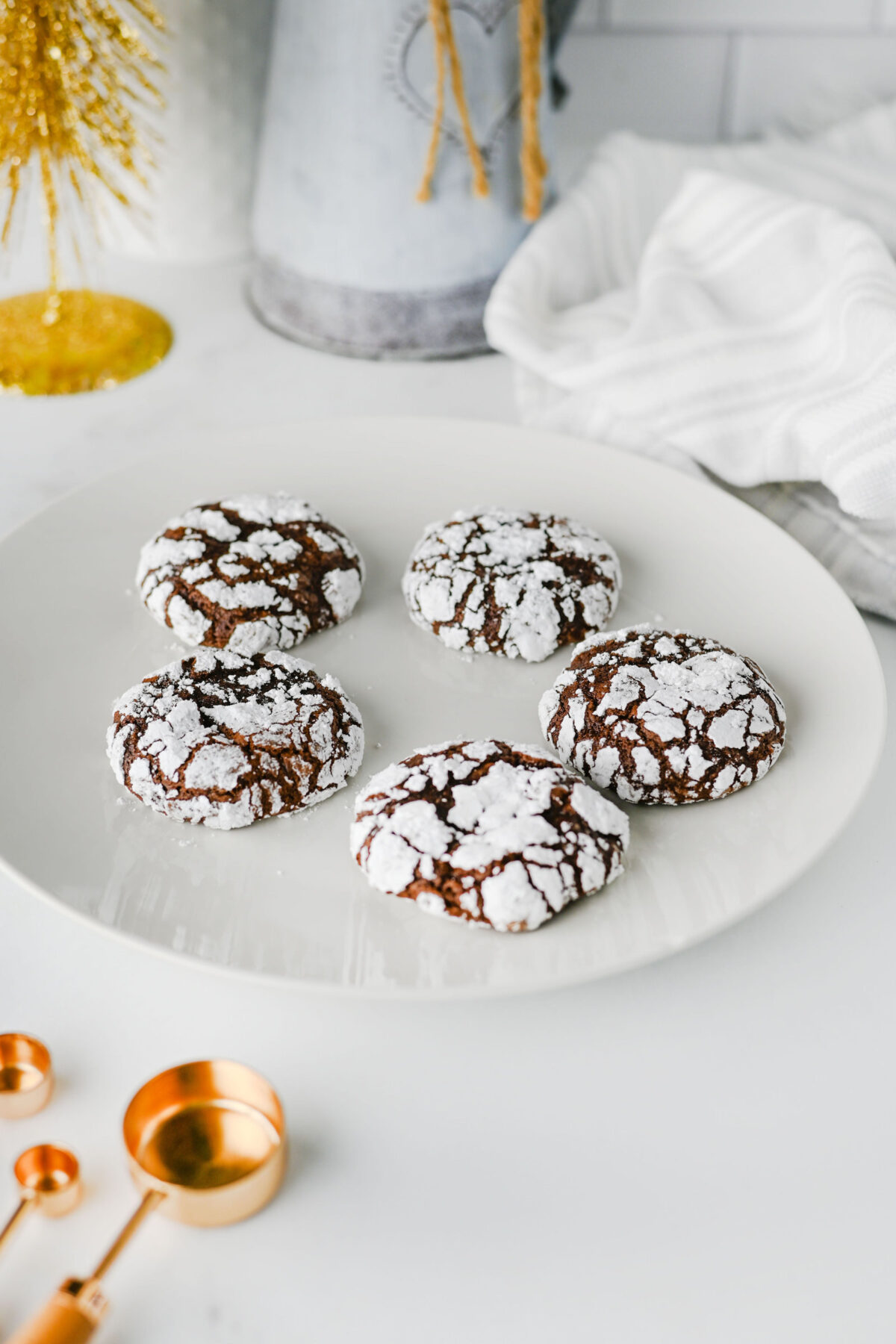 chocolate crackle cookies on a white plate