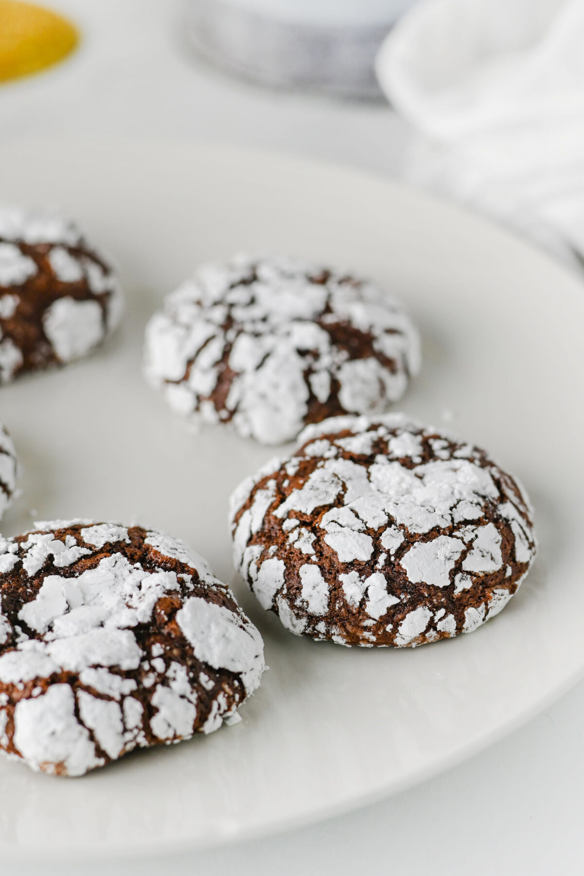 chocolate crackle cookies on a white plate