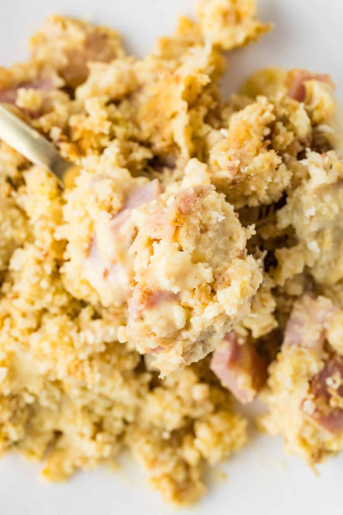 chicken cordon bleu casserole being scooped