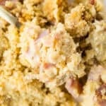 chicken cordon bleu casserole being scooped