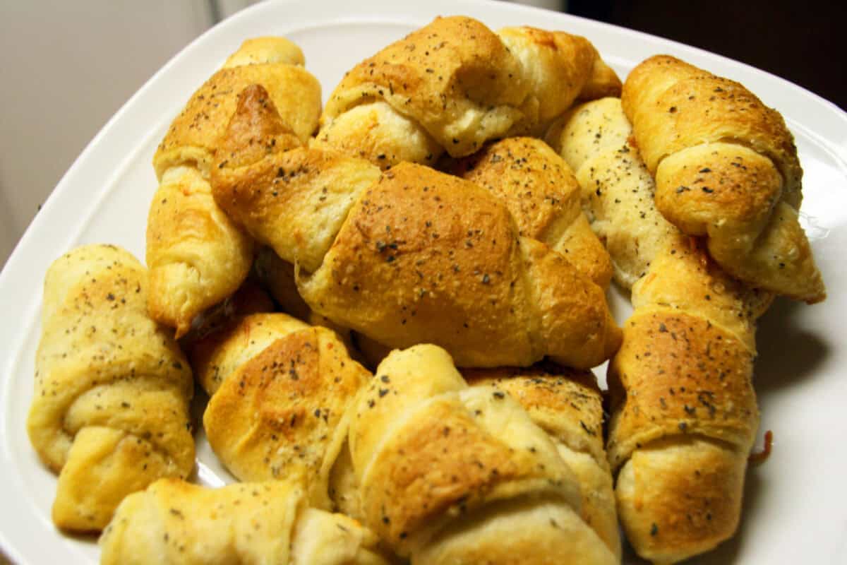Garlic Parmesan Crescent Rolls  stacked on a white plate
