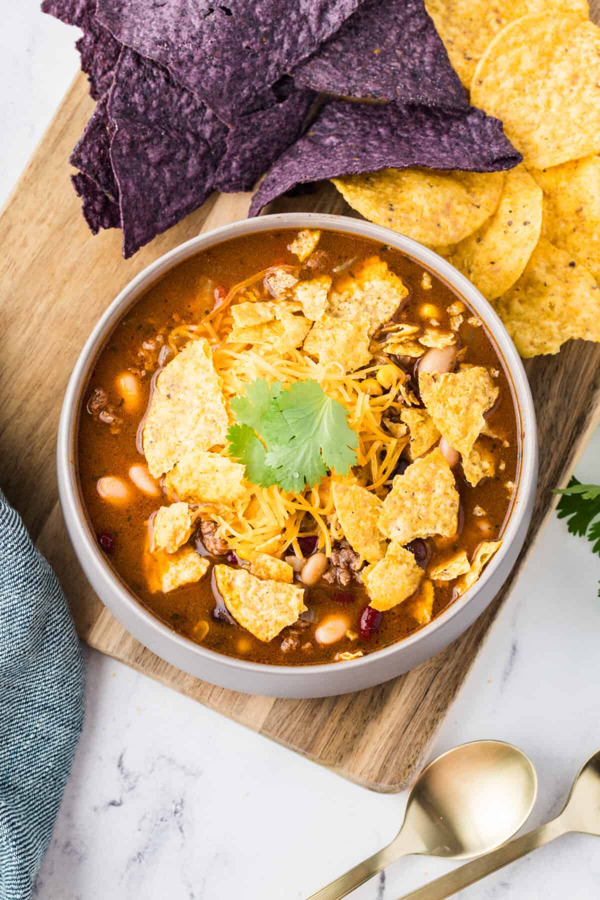 taco soup with chips and cheese and cilantro