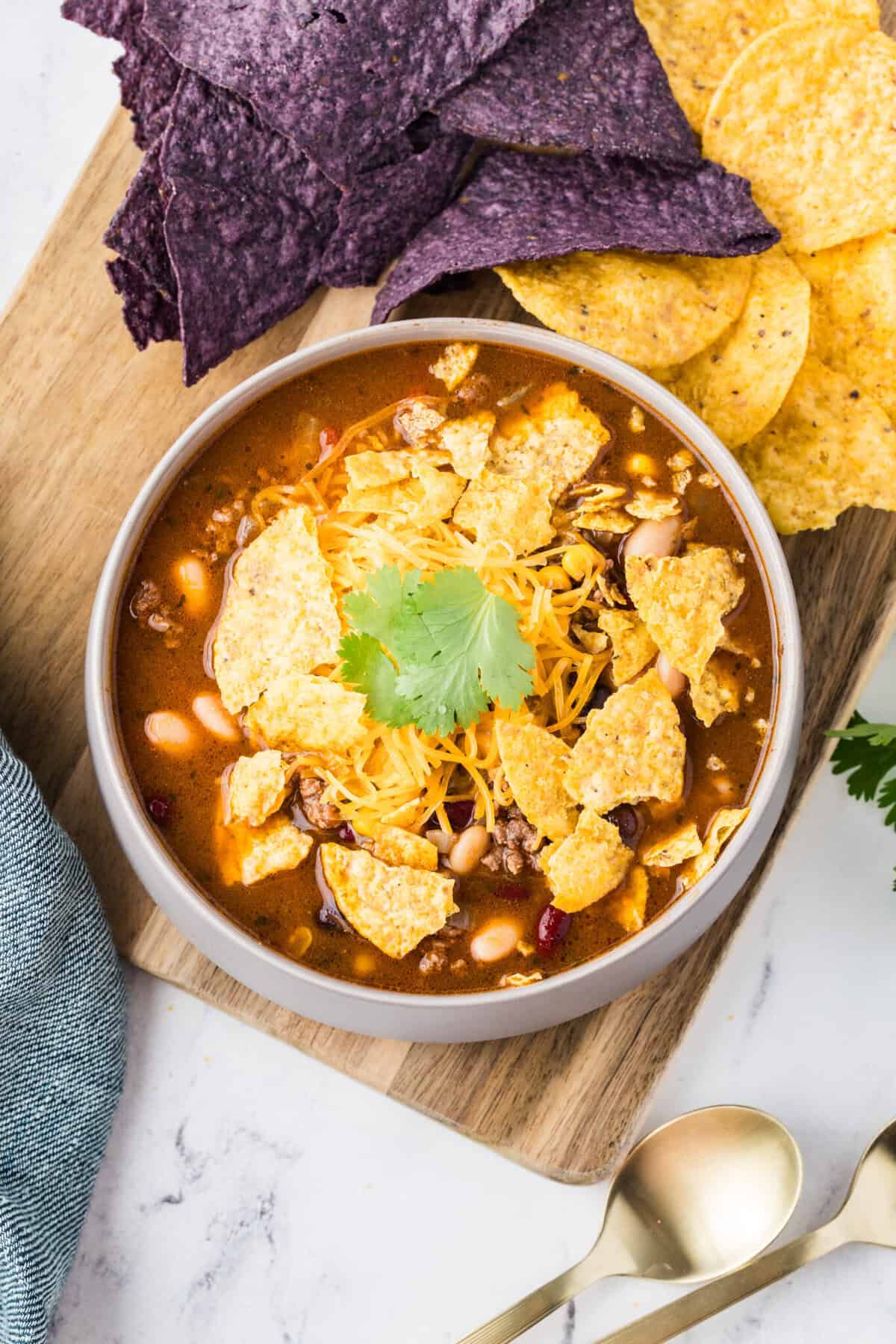 taco soup with chips and cheese and cilantro