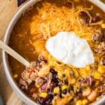 bowl of taco soup with sour cream and cheese