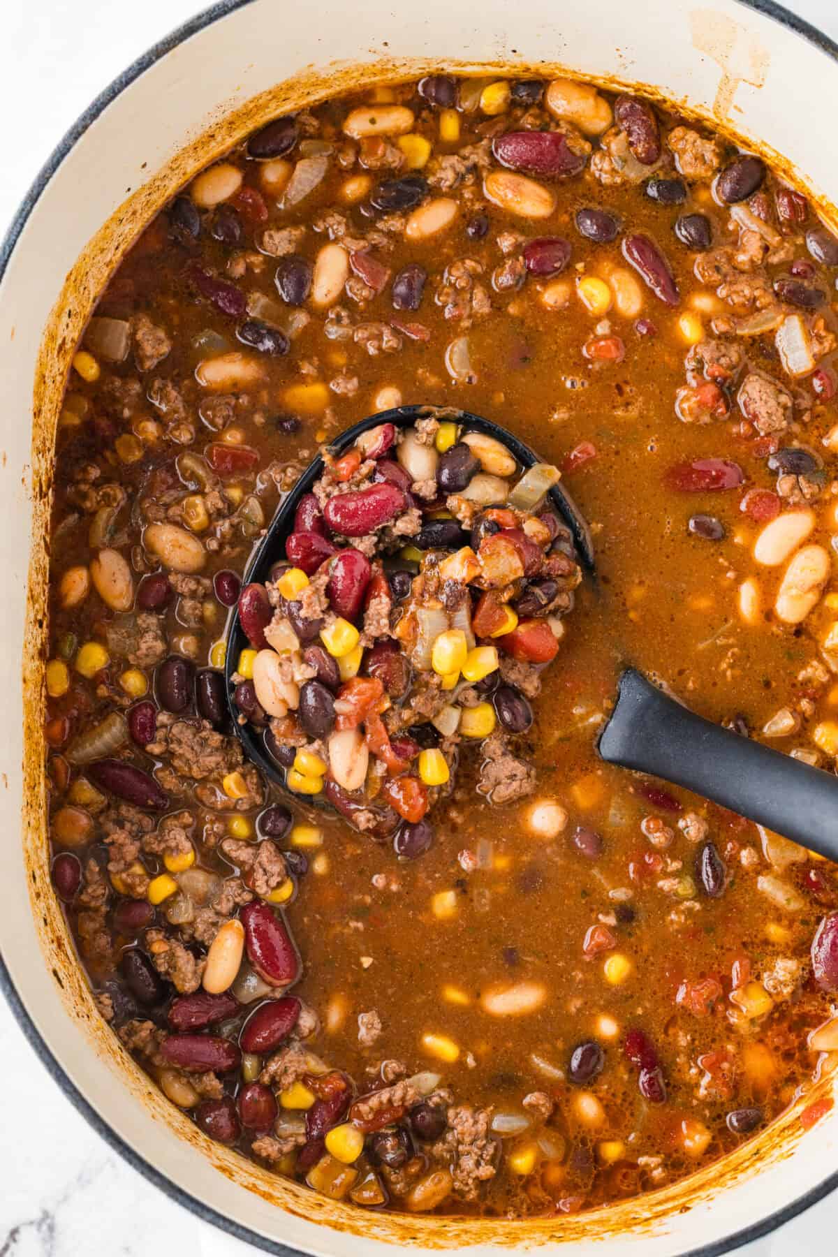 dutch oven full of taco soup with a ladle