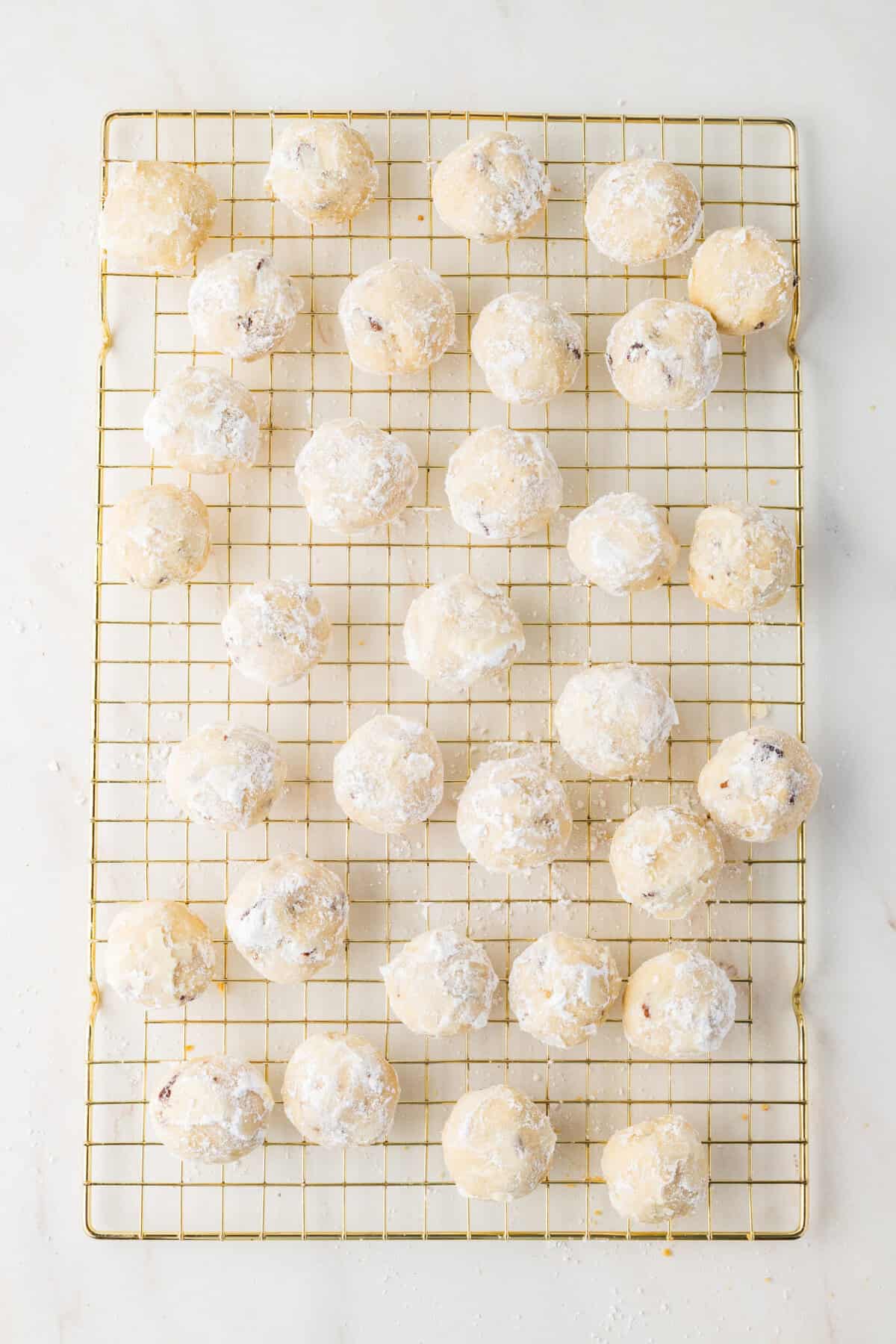 finished Mexican Wedding Cookies on a wire rack