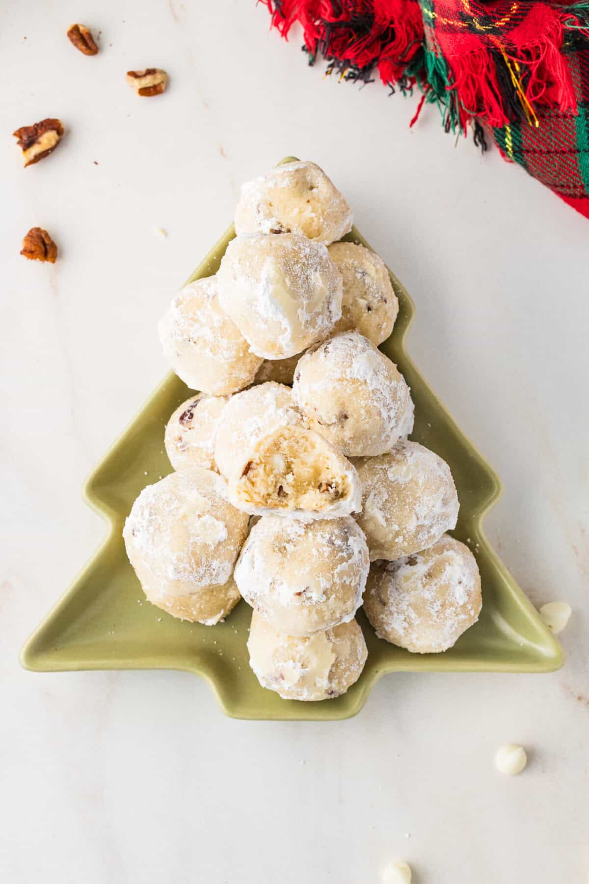 Mexican wedding cookies on a Christmas tree platter
