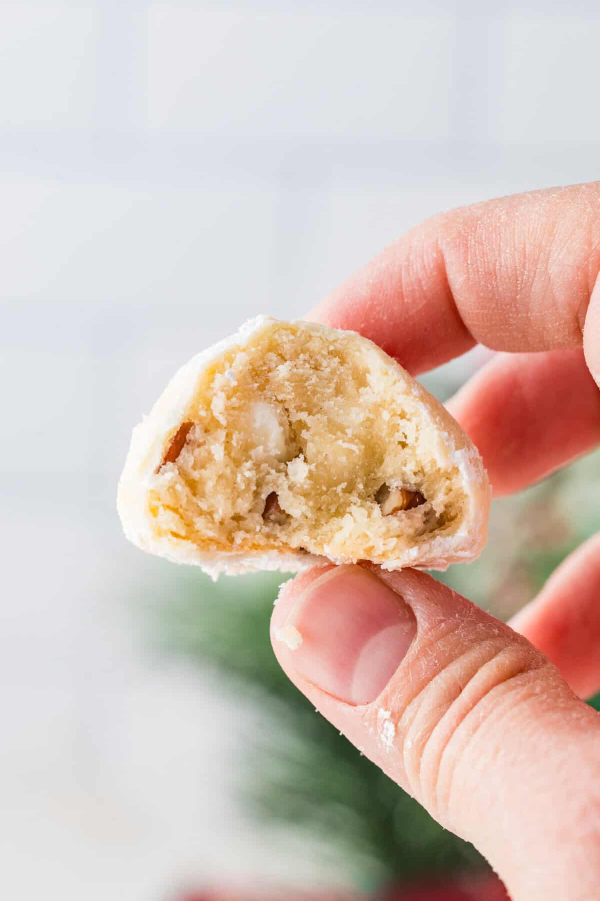 mexican wedding cookie with bite missing
