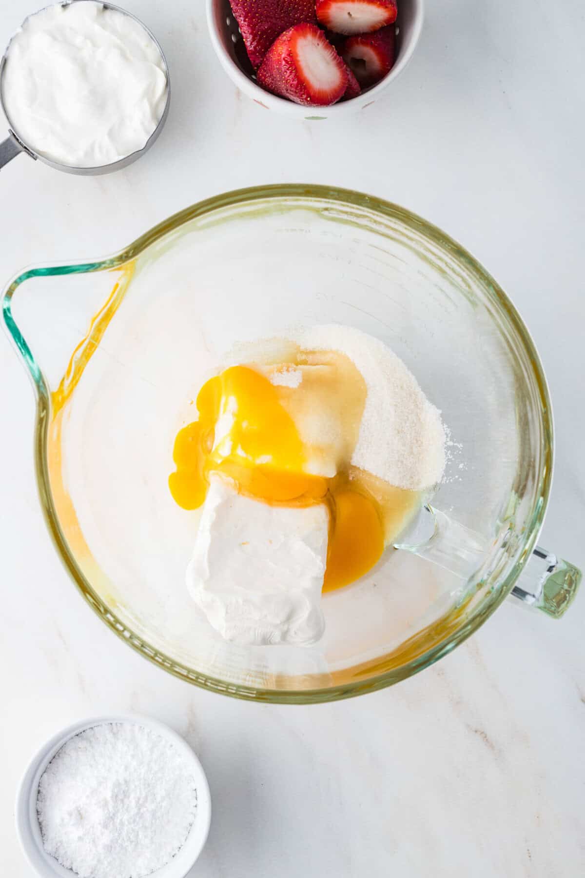 cheesecake filling ingredients in a mixing bowl