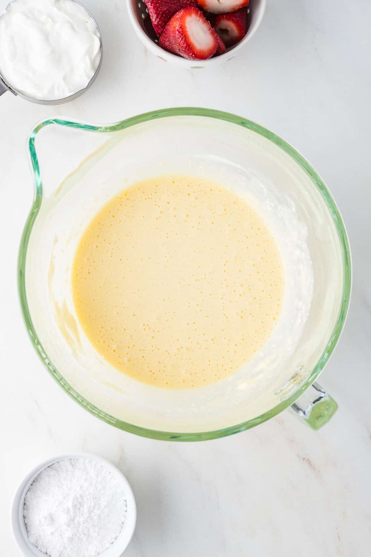 cheesecake filling mixed up in a bowl