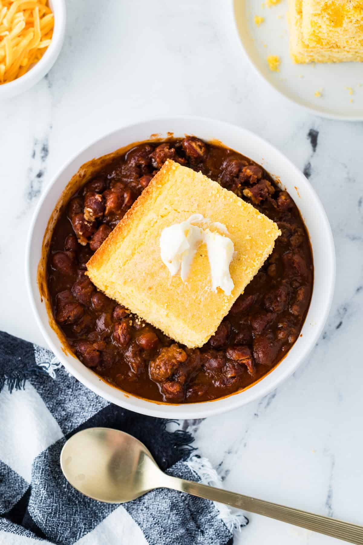 bowl of chili with buttermilk cornbread